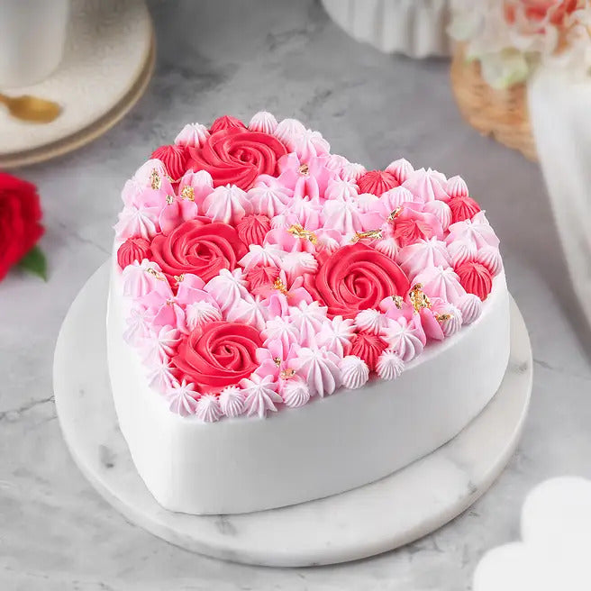 Petal Promise heart-shaped cake with pink floral cream decoration