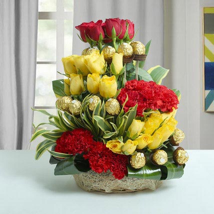 Ferrero Floral Basket with roses carnations and chocolates