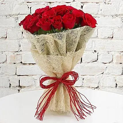 Red roses bouquet in rustic net wrap romantic flower gift