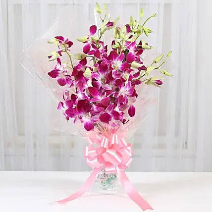 Purple orchids bouquet in glass vase premium flower gift