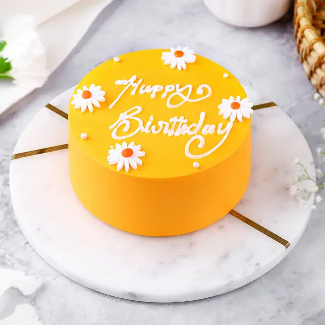 Butterscotch Daisy yellow birthday cake with daisy flowers and Happy Birthday message