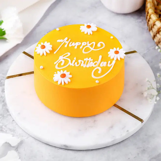Butterscotch Daisy yellow birthday cake with daisy flowers and Happy Birthday message