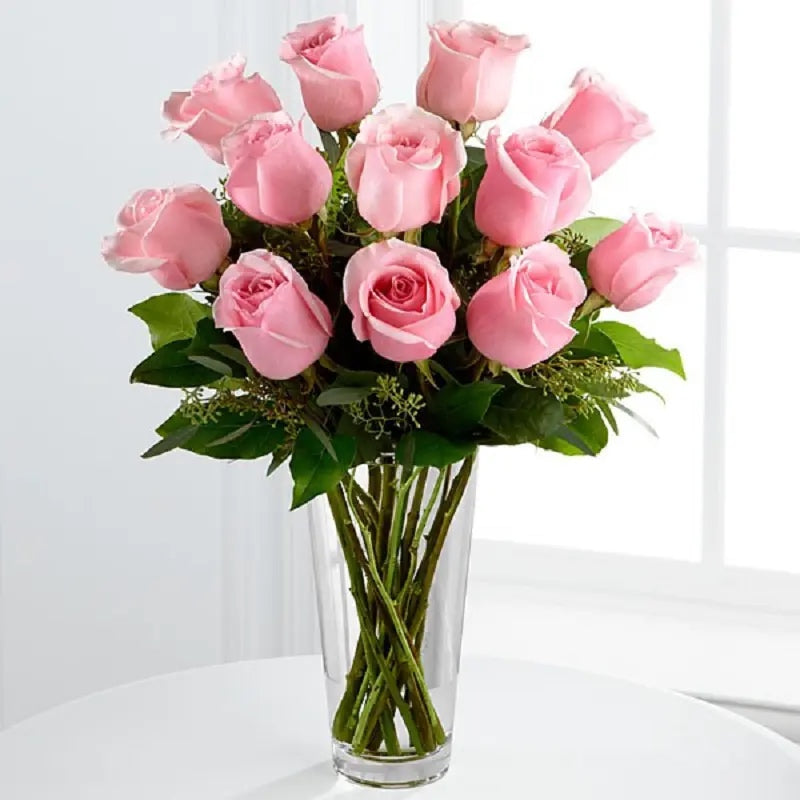 Fresh pink roses in glass vase for birthday anniversary and love gift