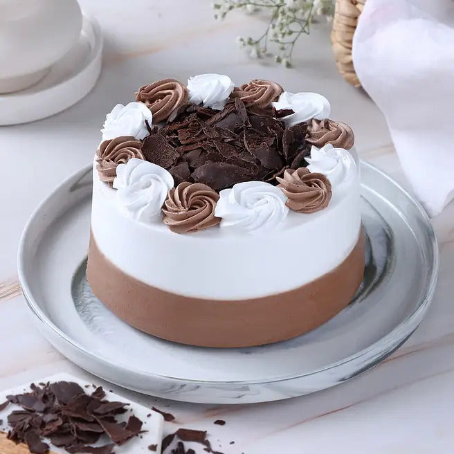 Frosty Truffle black forest cake with white cream, chocolate frosting and choco shavings