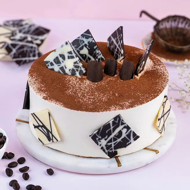 Mocha Elegance coffee cake with cocoa dusting and designer chocolate shards