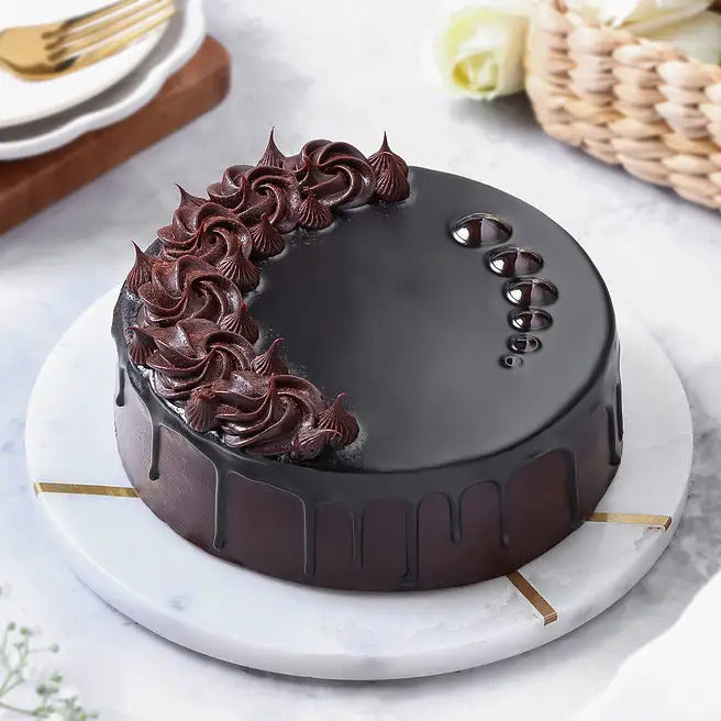 Obsidian Truffle eggless chocolate cake with glossy ganache and chocolate rosettes