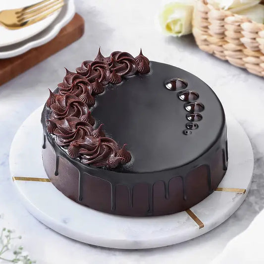 Obsidian Truffle eggless chocolate cake with glossy ganache and chocolate rosettes