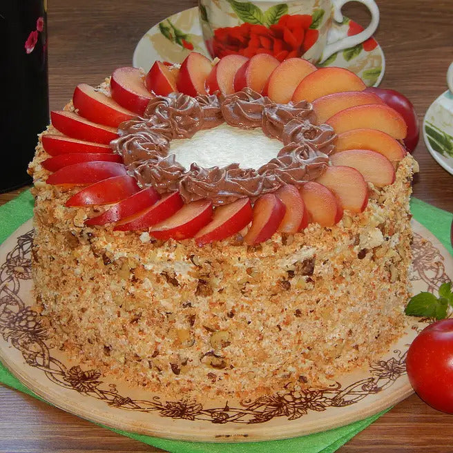 Orchard Crunch eggless fruit walnut cake with fresh fruit slices and chocolate cream