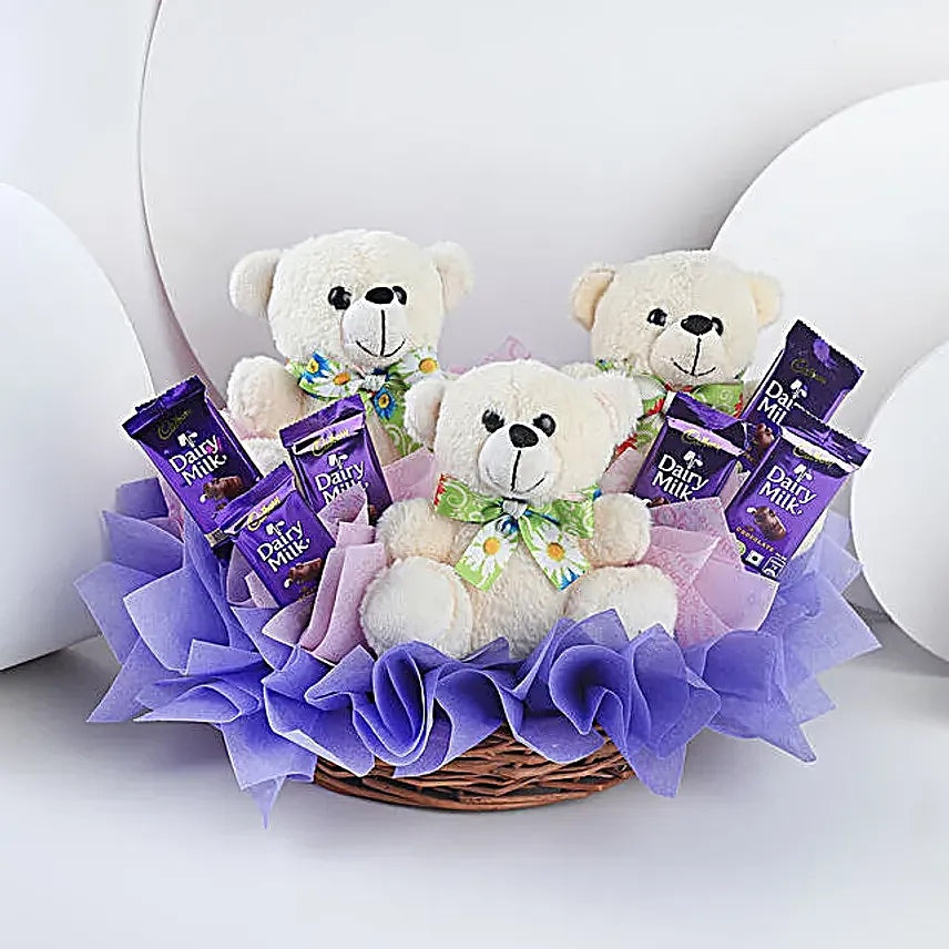 Three teddy bears with Dairy Milk chocolates in gift basket for birthday and kids surprise