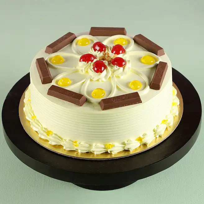 Wafer Royale butterscotch cake with chocolate wafer bars, cherries and cream frosting