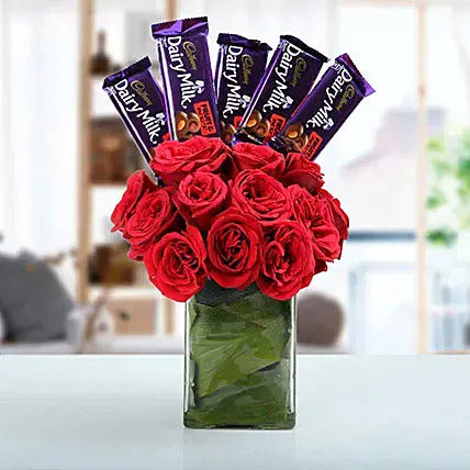 Red roses in glass vase with Dairy Milk chocolates flower chocolate arrangement gift