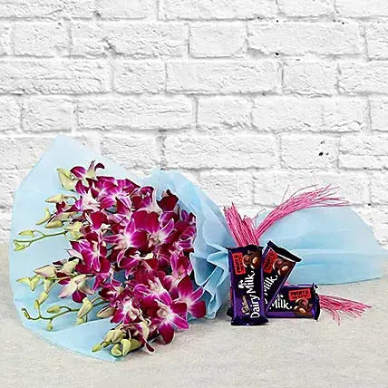 Purple orchid bouquet with Dairy Milk chocolates flower chocolate combo gift