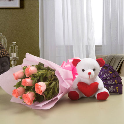 Pink roses bouquet with teddy bear and Dairy Milk chocolates for gift