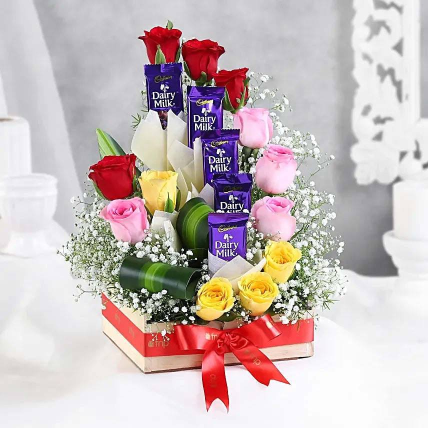 Mixed roses arrangement with Dairy Milk chocolates in premium floral gift box