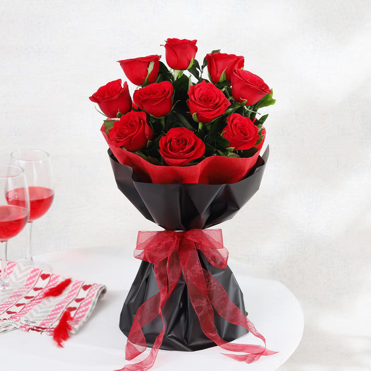 Fresh red roses bouquet in black wrapping for anniversary and romantic gift