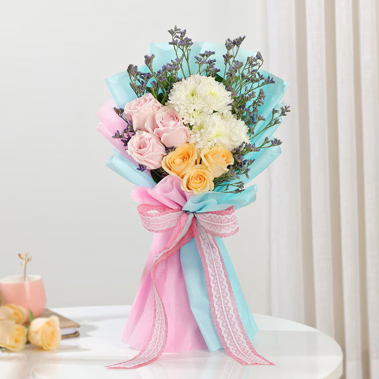 Pastel mixed flower bouquet with pink roses, white chrysanthemums and limonium fillers