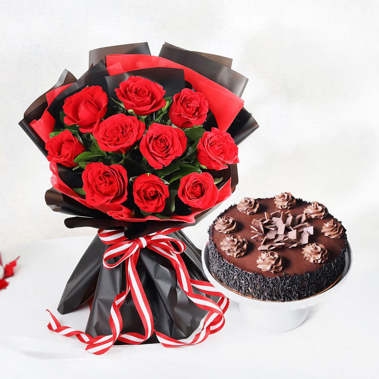 Red roses bouquet in black wrapping with chocolate truffle cake for romantic gift delivery