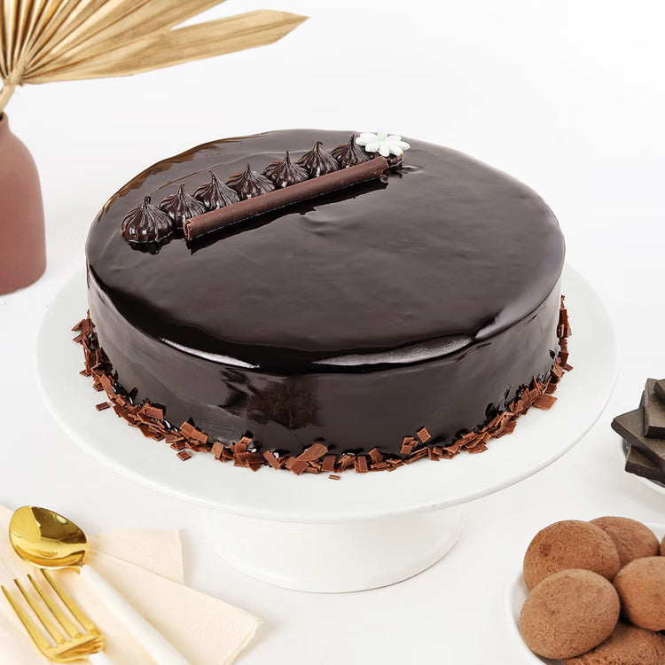 Glossy chocolate truffle cake with ganache and choco flakes for birthday delivery