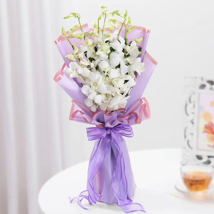 White orchid bouquet in lavender wrapping for same day flowe