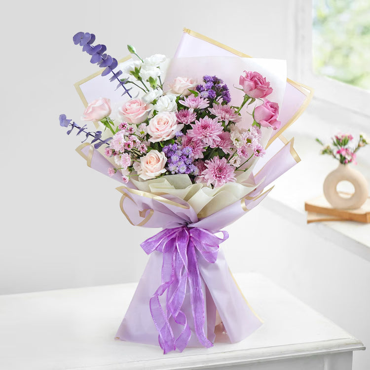 Lilac mixed flower bouquet with pink roses and purple chrysanthemums for flower delivery