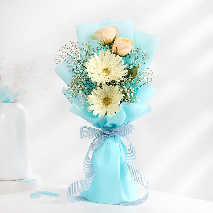 Aqua Rose Gerbera Bouquet with peach roses, white gerberas, baby’s breath and blue wrapping