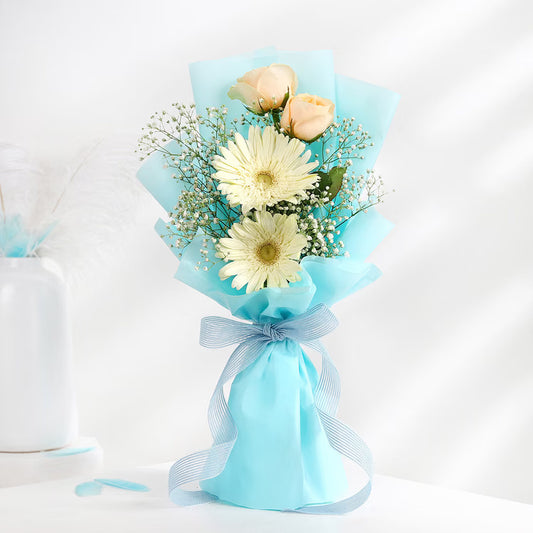 Aqua Rose Gerbera Bouquet with peach roses, white gerberas, baby’s breath and blue wrapping
