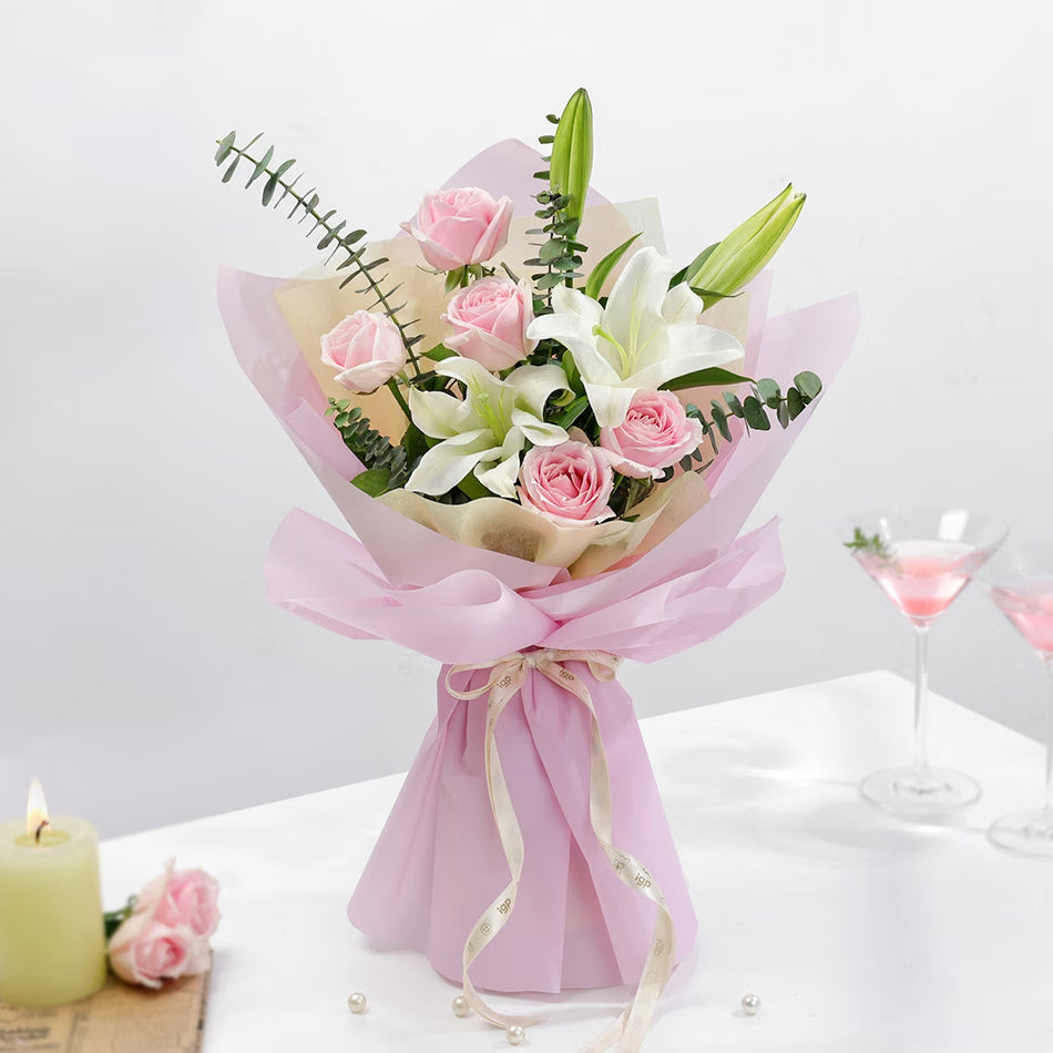 Pink roses and white lilies bouquet in premium pink wrapping for birthday anniversary and elegant gift
