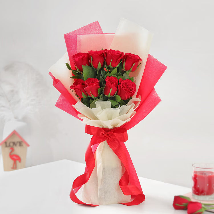 10 fresh red roses bouquet in red and cream wrapping with ribbon