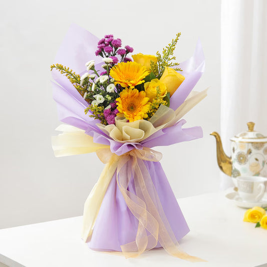 Yellow roses and gerberas mixed bouquet with purple flowers in lavender wrapping