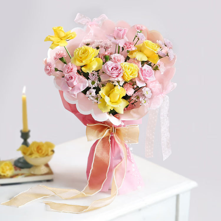 Pink and yellow roses bouquet in premium pink wrapping for birthday anniversary and congratulations gift