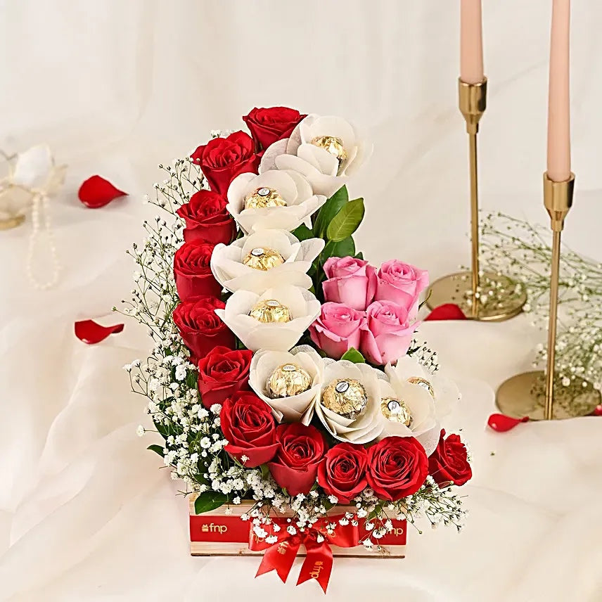 Premium red and pink rose arrangement with Ferrero Rocher chocolates in gift box