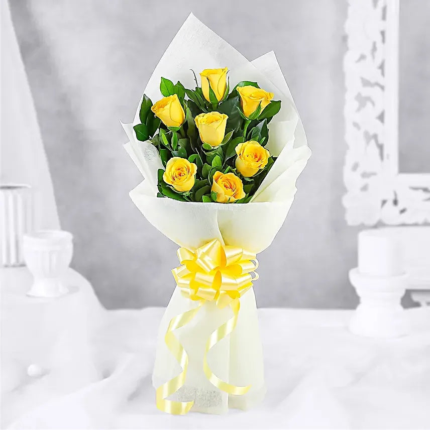 Fresh yellow roses bouquet in white wrapping for friendship birthday and congratulations gift