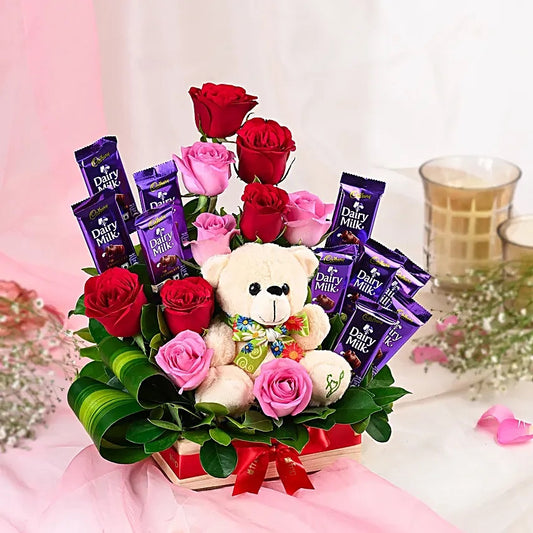 Teddy bear with Dairy Milk chocolates and red pink roses basket for birthday and anniversary gift