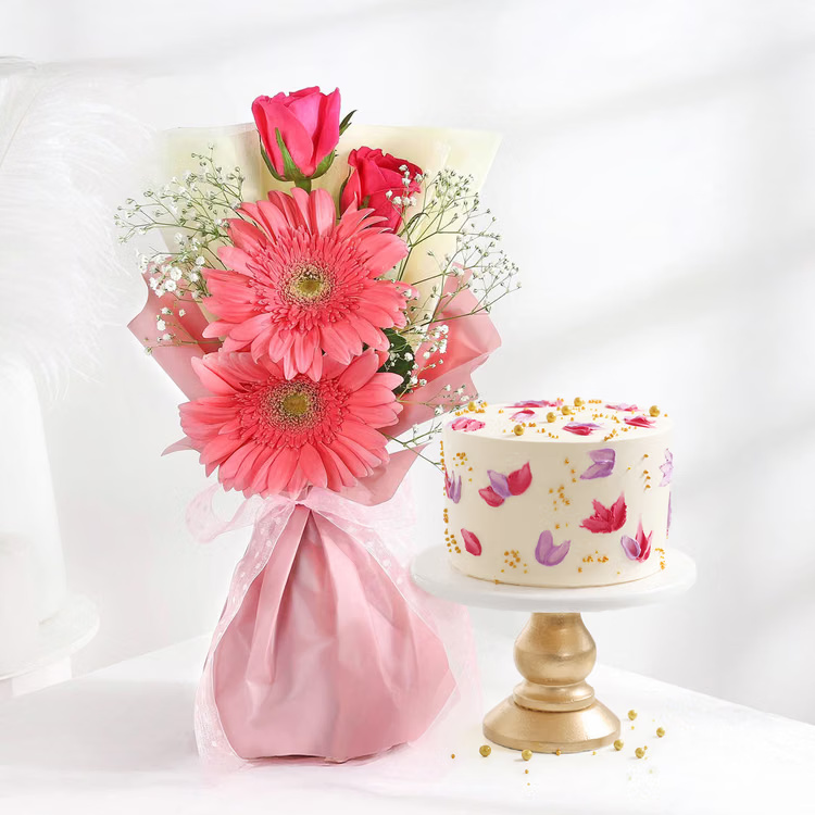 A cheerful pink gerbera and rose bouquet paired with a floral designer cake for birthdays and celebrations. Pink gerbera and rose bouquet with floral designer cake for same day gift delivery India