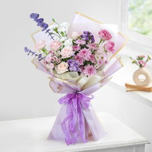 Lilac mixed flower bouquet with pink roses and purple chrysanthemums for flower delivery