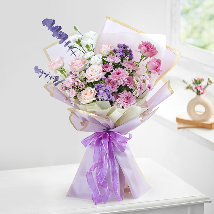 Lilac mixed flower bouquet with pink roses and purple chrysanthemums for flower delivery