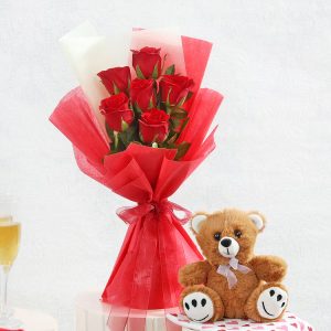 Fresh red roses bouquet with cute teddy bear gift combo for romantic delivery