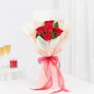 6 fresh red roses bouquet in peach love-note wrapping with red ribbon