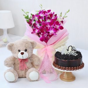 Purple orchid bouquet with teddy bear and chocolate cake for birthday anniversary and romantic gift